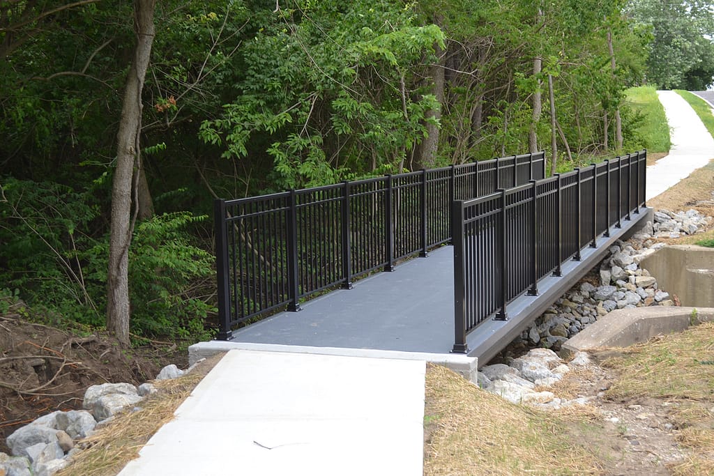 A beam bridge is a simple yet effective pedestrian bridge option.